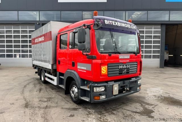 Camión plataforma con toldo MAN TGL 12.240 4x2 ADR