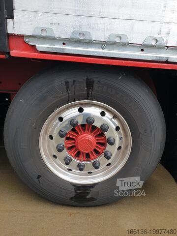Причіп з бортовою платформою та тентом FLIEGL 3-Achs Gardine SDS 390 RoadRunner
