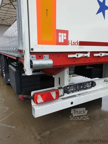 Причіп з бортовою платформою та тентом FLIEGL 3-Achs Gardine SDS 390 RoadRunner