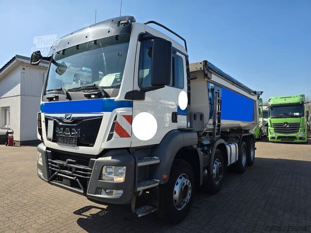 Pašizgāzējs kravas automašīna MAN TGS 35.420 8x4BB Muldenkipper Schmitz Stahl
