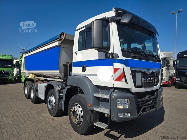 Pašizgāzējs kravas automašīna MAN TGS 35.420 8x4BB Muldenkipper Schmitz Stahl