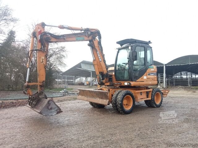 Mobiele graafmachine Case WX95 with 4 excavator buckets and forks