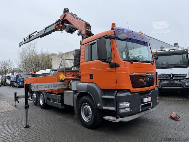 Flatbed truck MAN TGS 26.480 6X4H-2 Kran Fassi F310 18.50 Meter