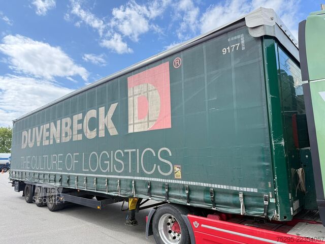 Komerciālais transportlīdzeklis Schmitz Cargobull 3 Achs Mega Trailer Hubdach top Reifen verzinkt