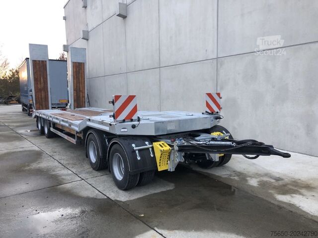 Низкорамный прицеп Möslein T 4 VB H1  neuer 4 Achs Tieflader hydraulischen Rampen