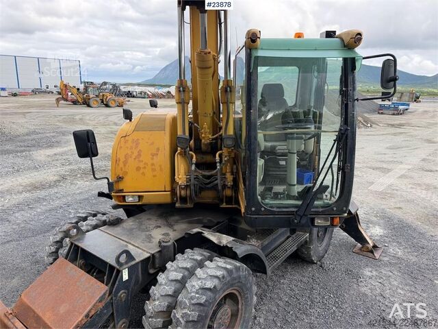 Tekerlekli ekskavatör Caterpillar M313C